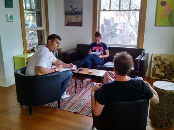 Students interviewing at a participants' home